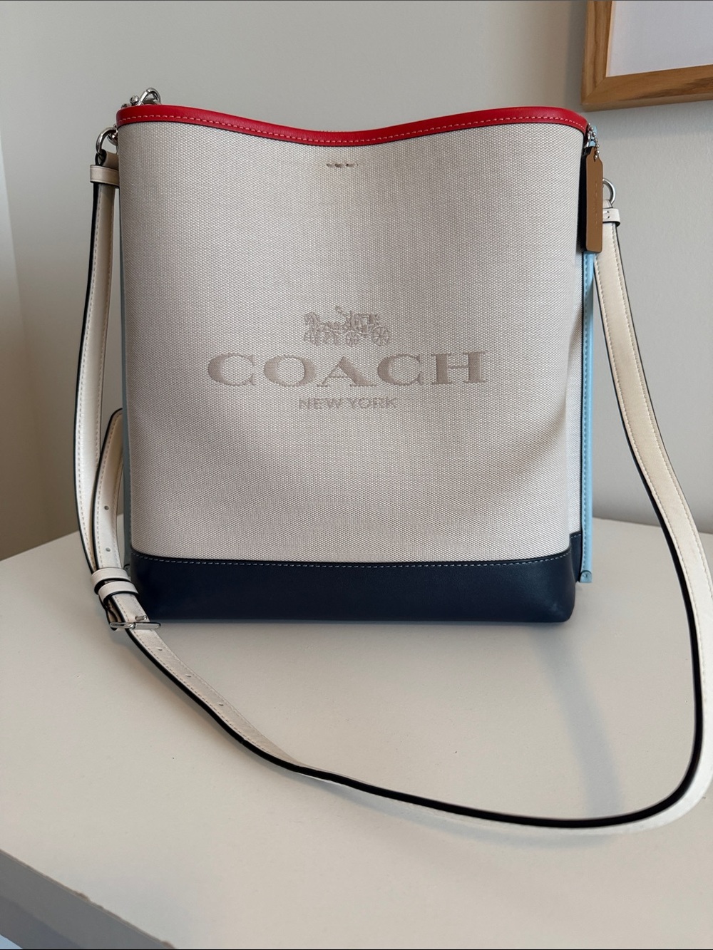 COACH Cream Canvas Bucket Bag with Navy Base and Red Trim